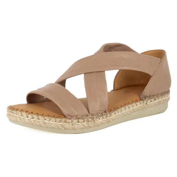 Beige sandal with woven sole on a white background
