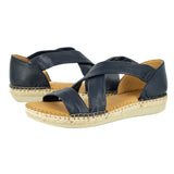 Pair of navy blue sandals with woven sole on a white background