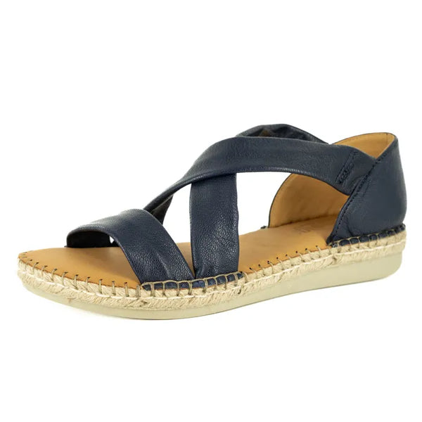 Navy blue sandal with a beige sole on a white background