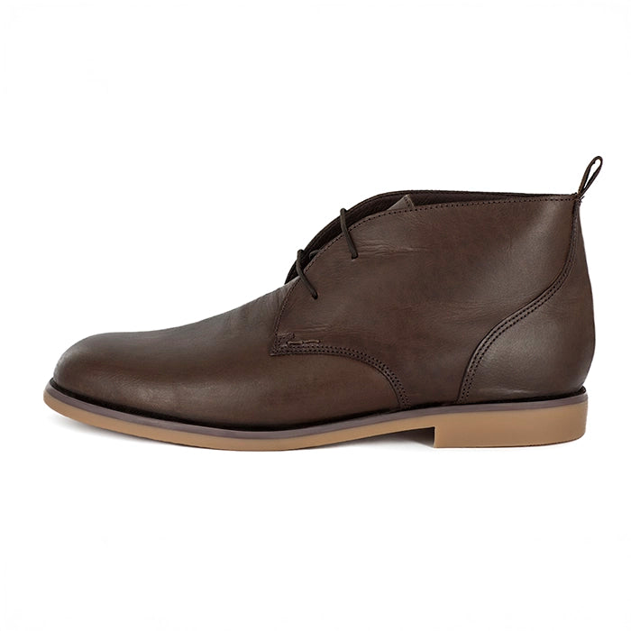 Brown leather boot on a white background