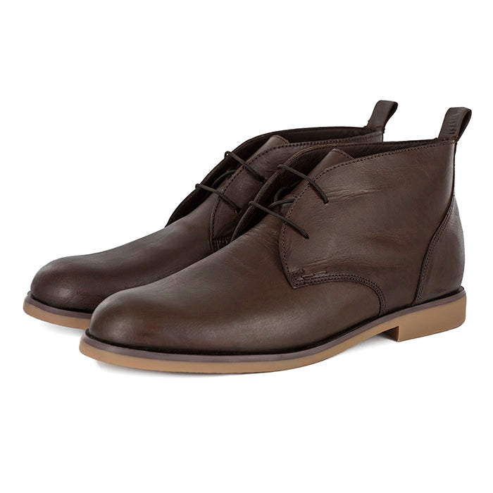 Pair of brown leather boots on a white background