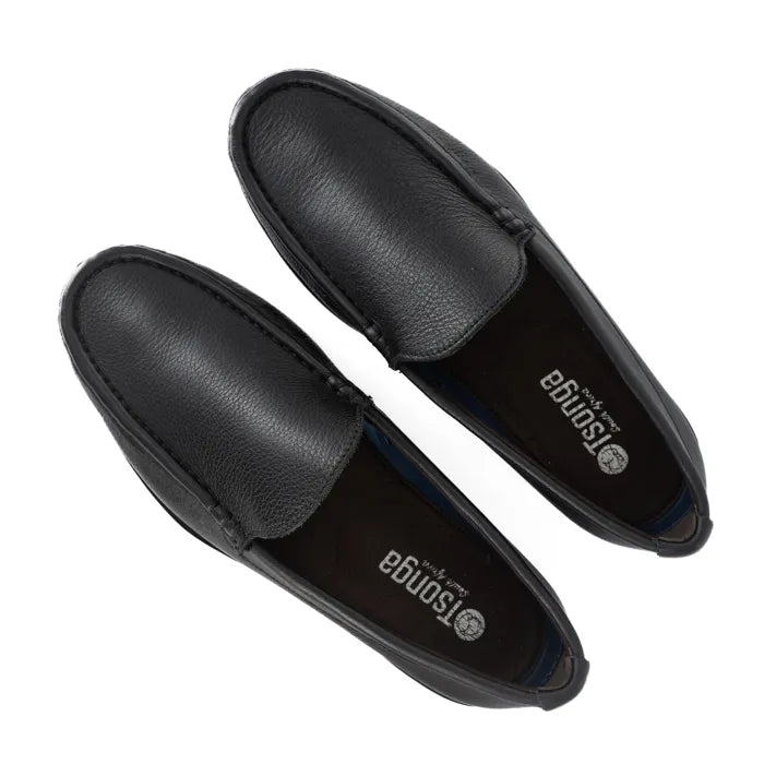Pair of black loafers on a white background