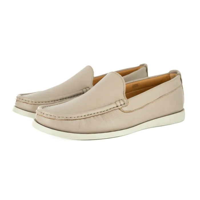 Pair of beige loafers on a white background