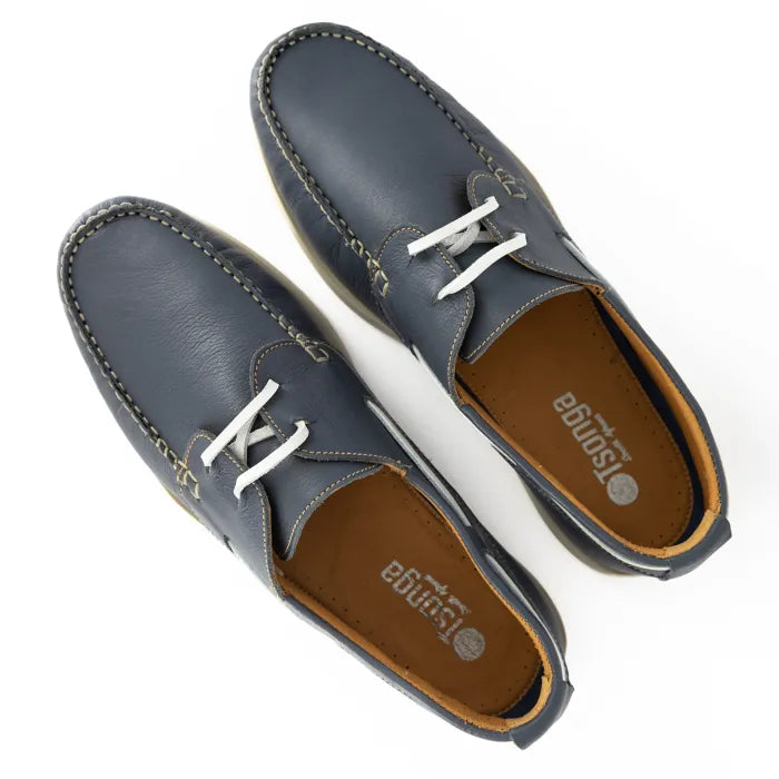 Pair of navy blue leather shoes with white laces on a white background