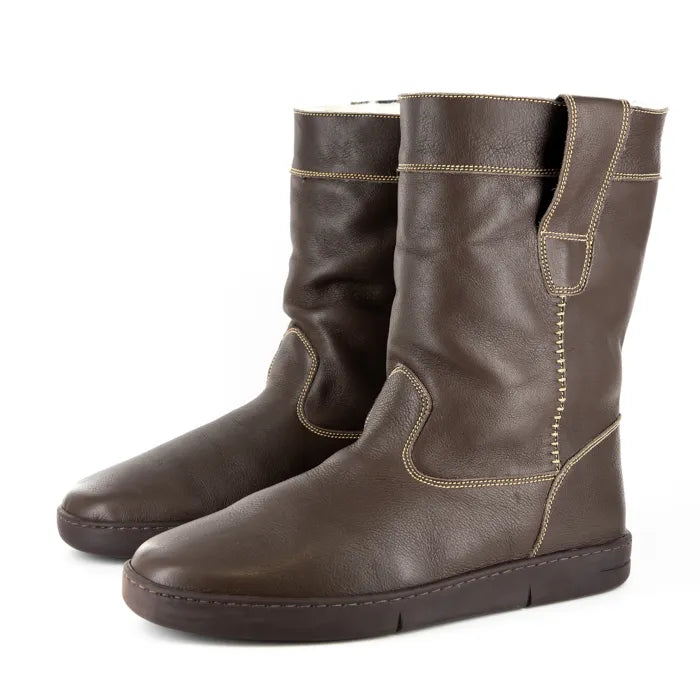 Pair of brown leather boots on a white background
