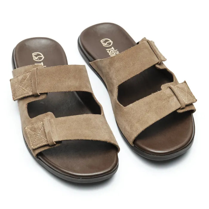 A pair of men's slide sandals with taupe-brown suede straps and dark brown footbeds, shown on a plain white background.