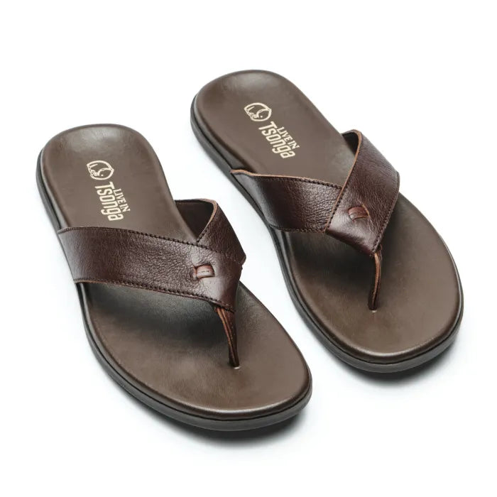 A pair of dark brown leather thong sandals with cushioned soles, displayed on a clean white background. The brand name 'Tsonga' is printed in gold on the insole of each sandal.