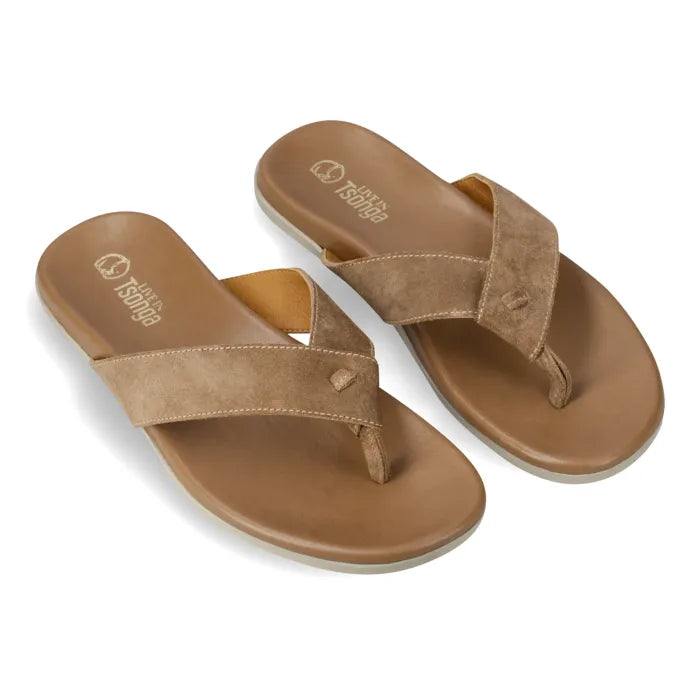 A pair of tan leather thong sandals with wide crisscross straps and a contoured footbed, shown on a clean white background. The brand name 'Tsonga' is printed on the footbed.