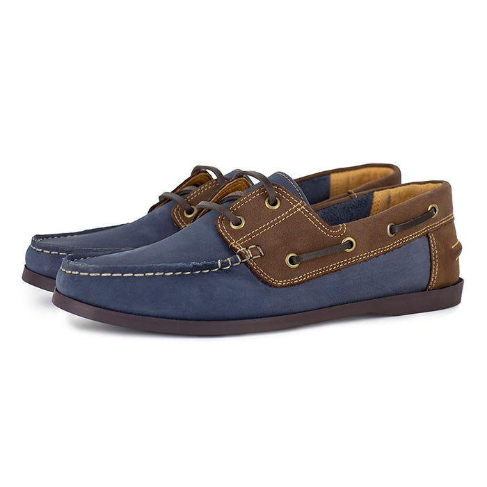 Pair of blue and brown boat shoes on a white background