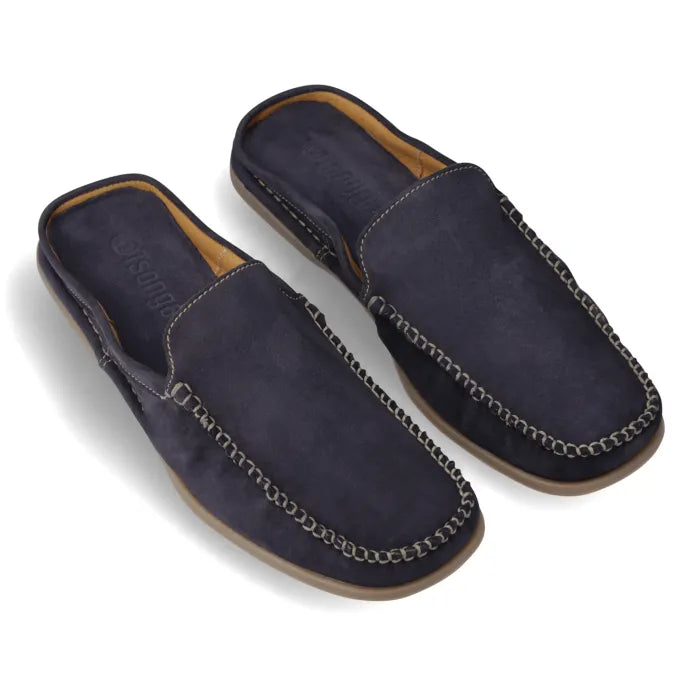 A pair of navy blue velvet men's mules with hand lace detail and a tan sole.