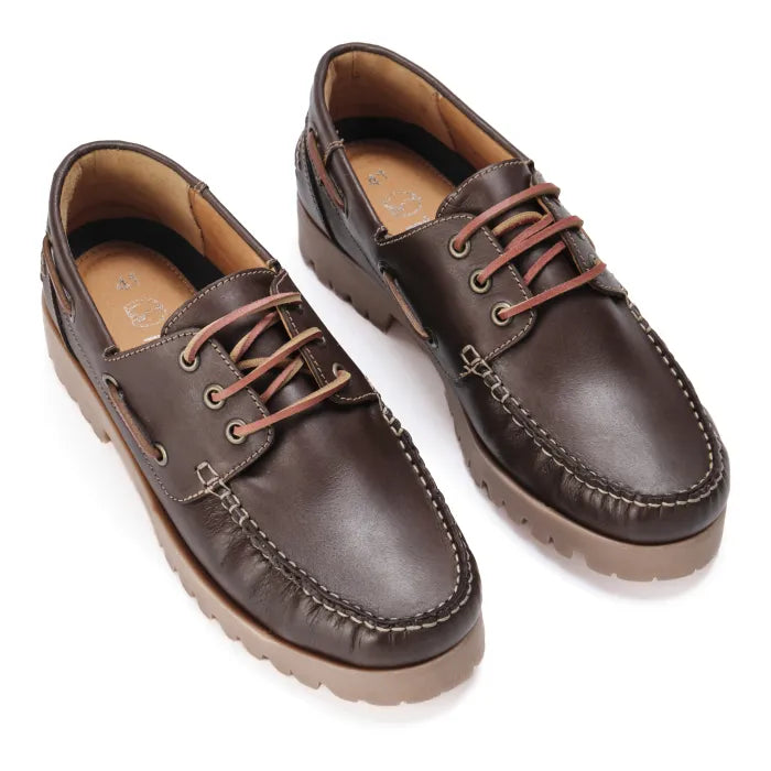 Pair of brown leather shoes with brown laces on a white background