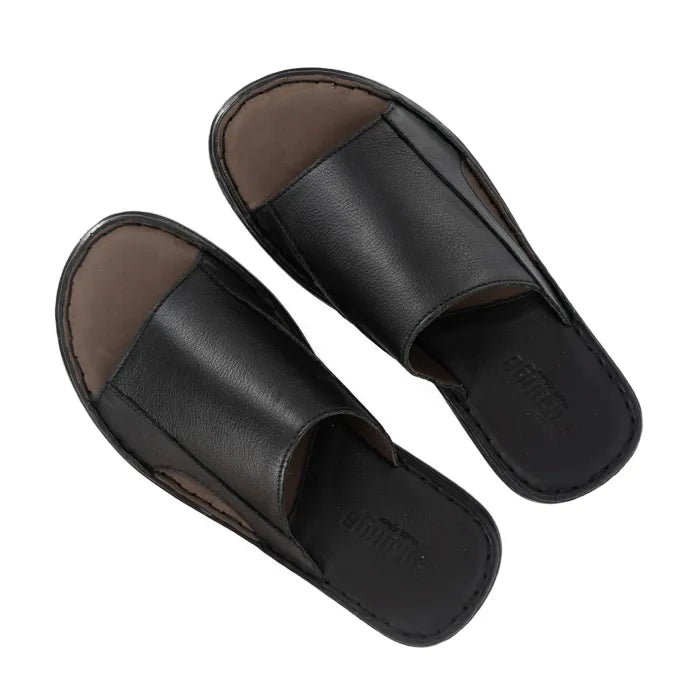 Pair of black slides with brown soles on a white background