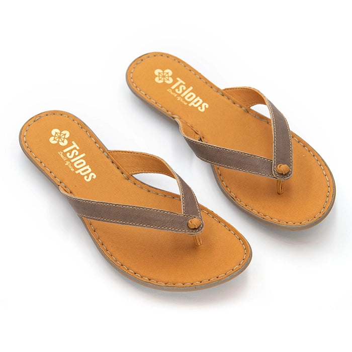 A pair of Tslops - flat thong sandals with tan footbeds and brown straps, displayed on a clean white background.
