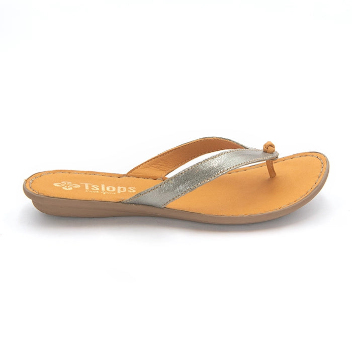A single women's thong sandal from Tsonga, featuring a metallic silver strap and a tan footbed, shown on a clean white background.