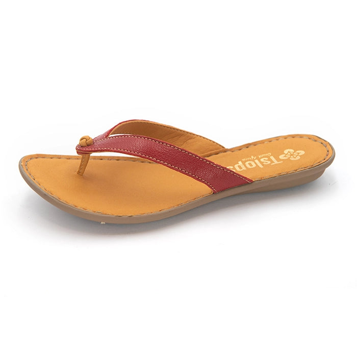 A single women's flip-flop sandal with a tan footbed and sole, featuring a contrasting red strap with a small decorative bead at the toe post. The brand name 'TIslops' is printed in gold on the footbed.