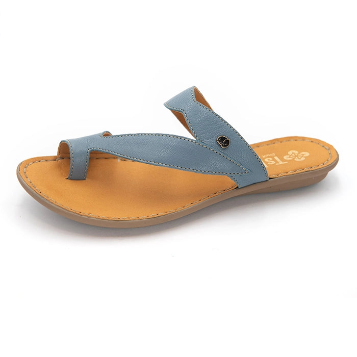 A single thong sandal with a dusty blue leather strap and a tan footbed, shown from a side profile on a white background.