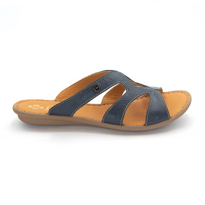 A single women's slide sandal with navy blue textured straps and a tan footbed, shown from a side profile on a white background.