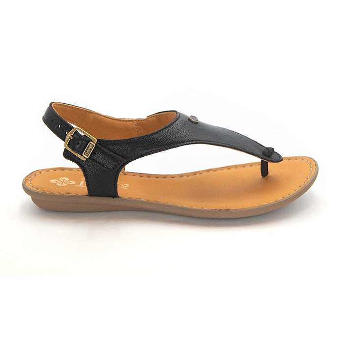 A single women's thong sandal shown in profile against a white background. The sandal features a black leather upper with a gold-tone buckle strap and a tan/beige contoured footbed and sole.