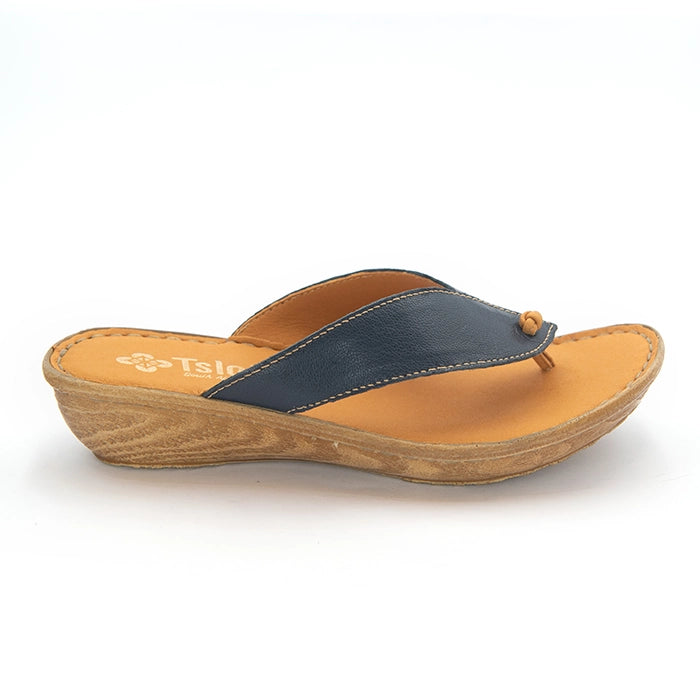 A single women's wedge thong sandal shown in side profile on a white background. The sandal features a navy blue leather strap with a small tan leather bead, a tan insole, and a brown wood-grain wedge heel.