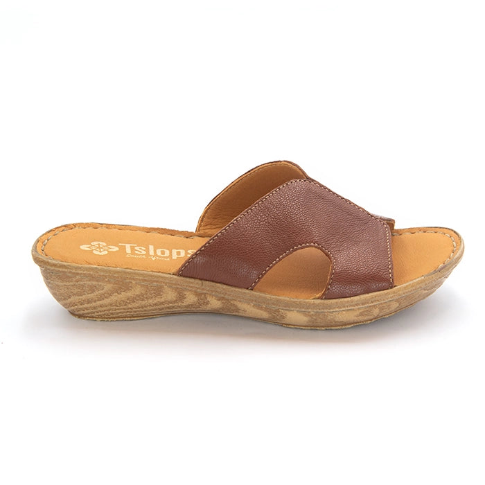 A single women's slide sandal with a textured brown leather upper and a wedge heel, shown from a side profile on a white background. The insole features the Tslops logo.