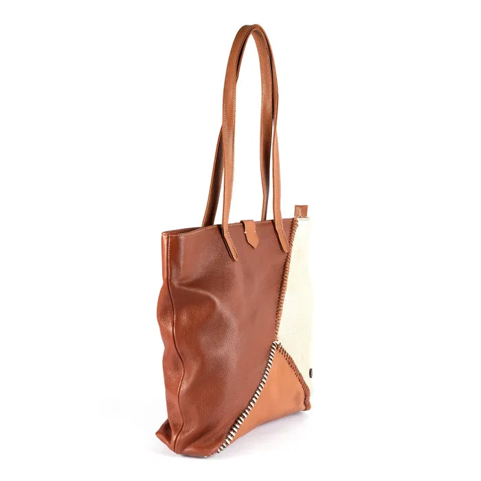 Brown leather tote bag with a white interior on a white background