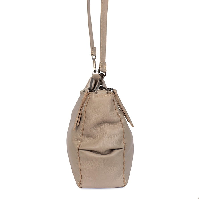 Beige handbag with a strap on a white background