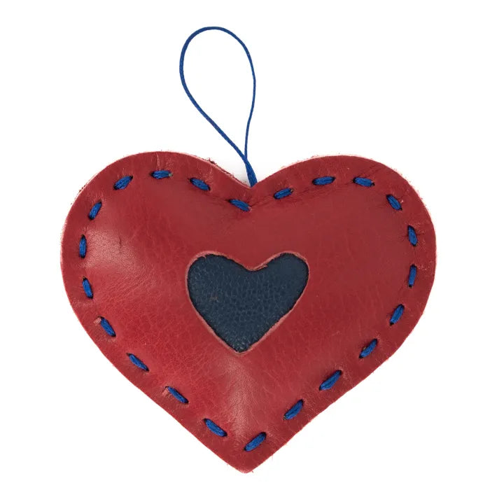 Red heart-shaped hanging ornament with blue stitching on a white background
