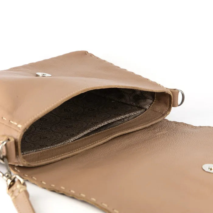 Close-up of a beige handbag with a white background