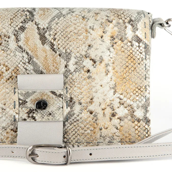 Snake print handbag on a white background