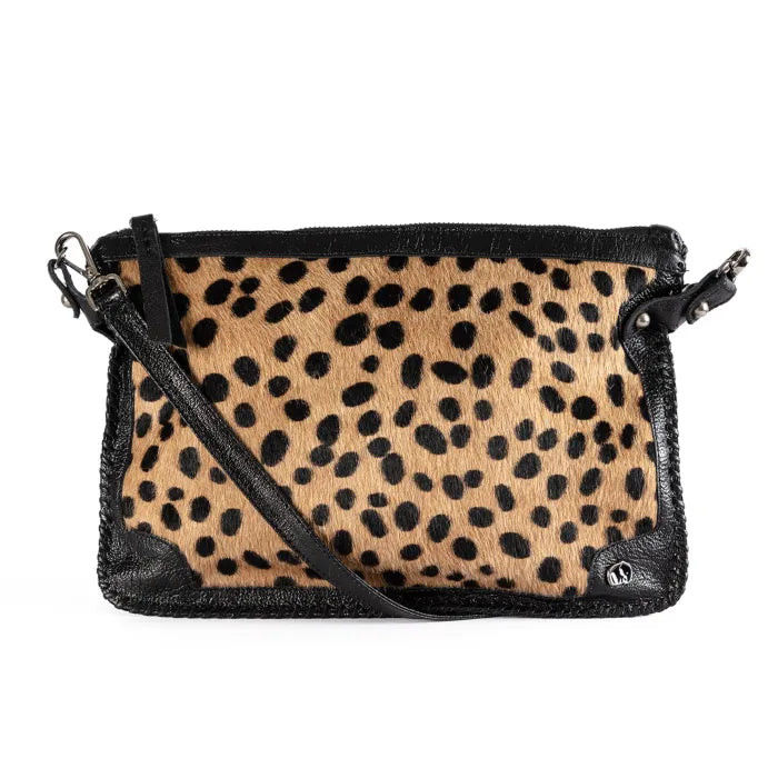 Spotted  print handbag with black trim on a white background
