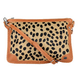 Crossbody bag with cheetah print and tan accents on a white background