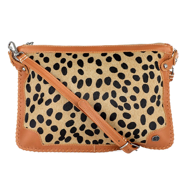 Crossbody bag with cheetah print and tan accents on a white background