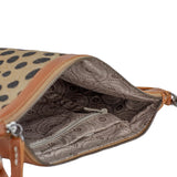 Open handbag with cheetah print exterior and patterned interior on a white background