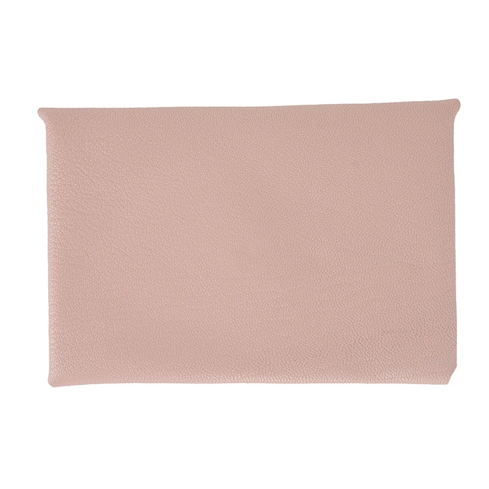 Front of pink leather clutch purse.