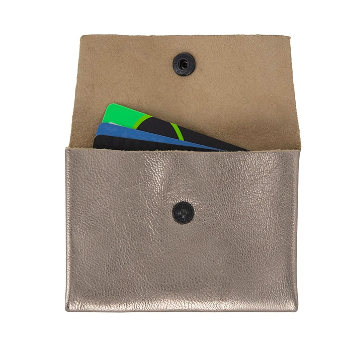 Two pocket leather card holders with cards inside on a white background