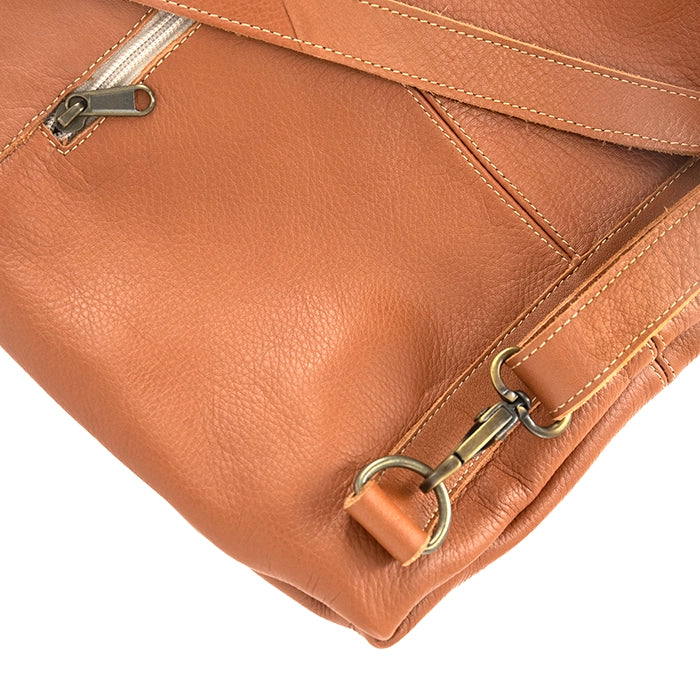 Close-up of a tan leather bag with a gold zipper and clasp on a white background
