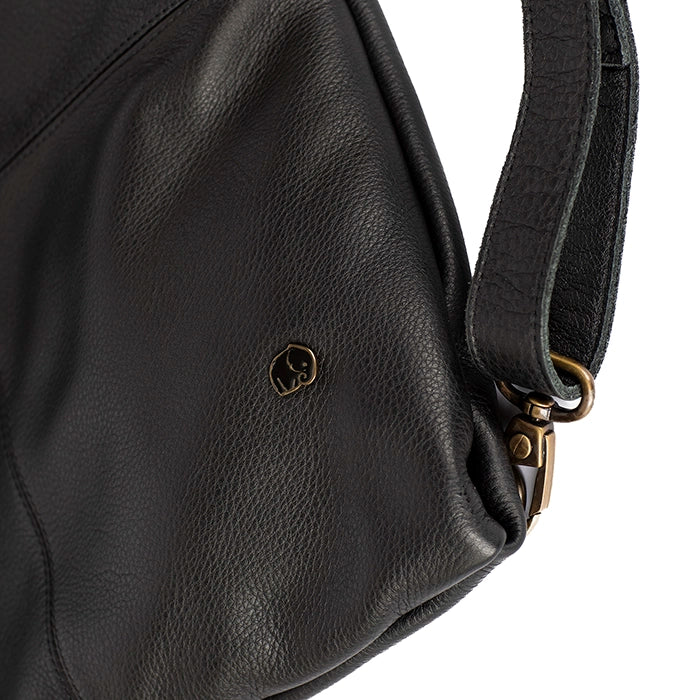 Black leather handbag with a strap and visible brand logo on a white background