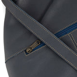 Denim leather bag with a zipper detail on a white background