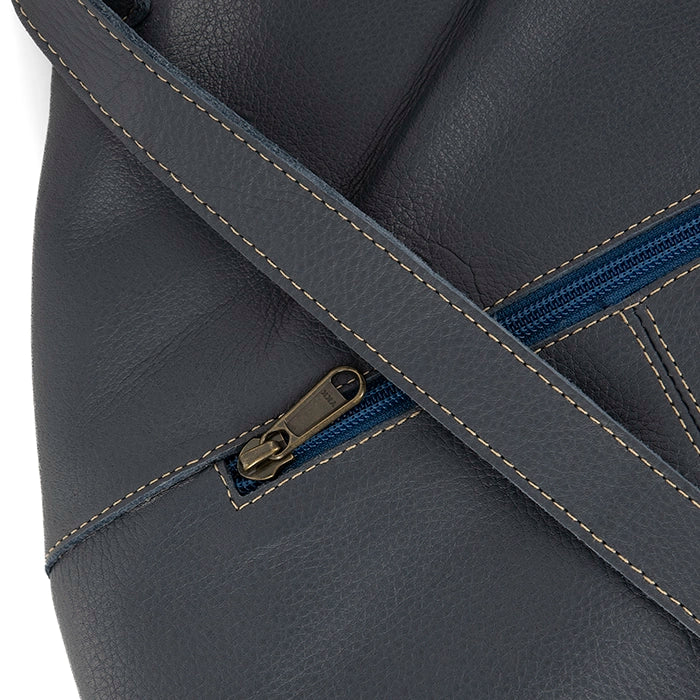 Denim leather bag with a zipper detail on a white background