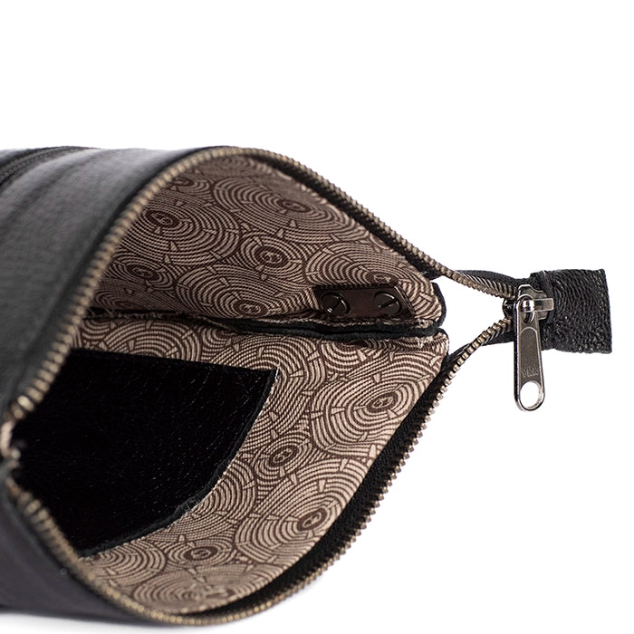 Close-up of the interior with a patterned pouch with a zipper on a white background