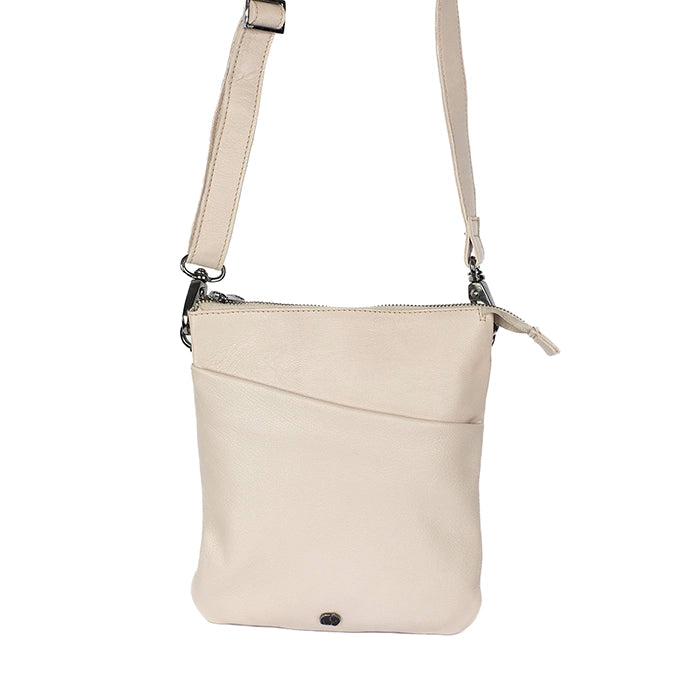 Beige crossbody bag on a white background