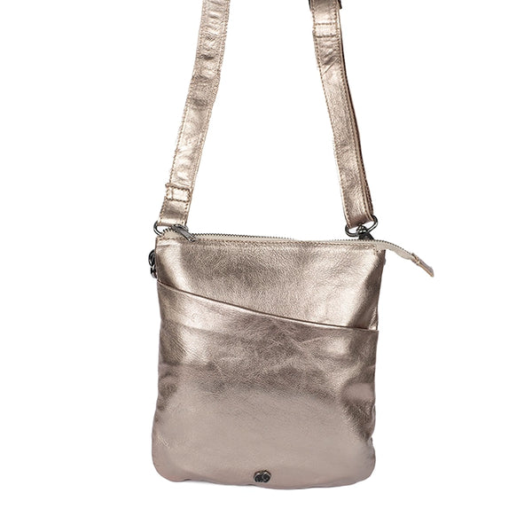 Front view of a gold leather crossbody bag on a white background