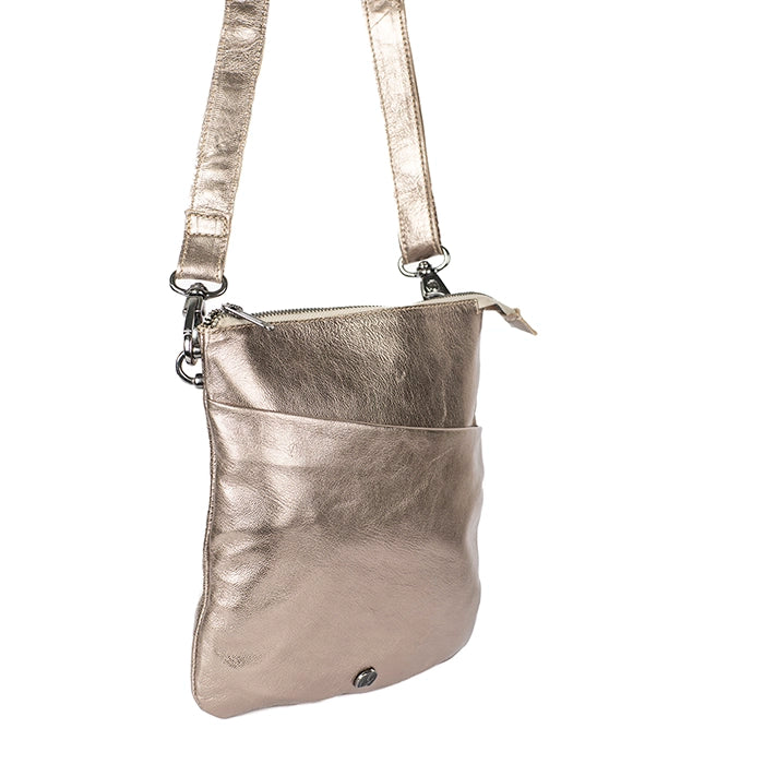 Metallic gold crossbody bag on a white background