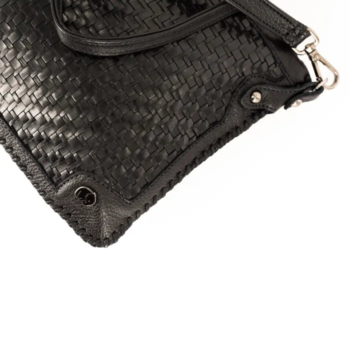 Black woven leather clutch bag on a white background