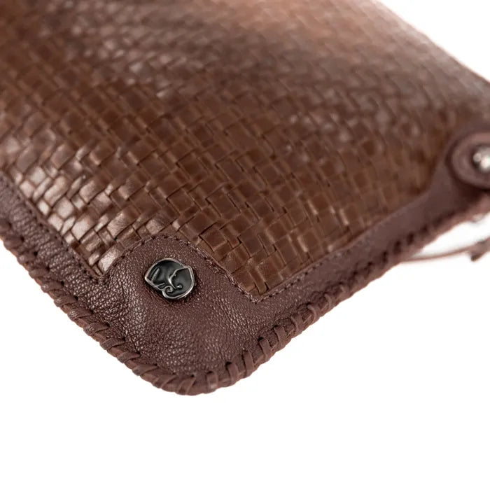 Close-up of a brown textured pouch with a metal clasp on a white background