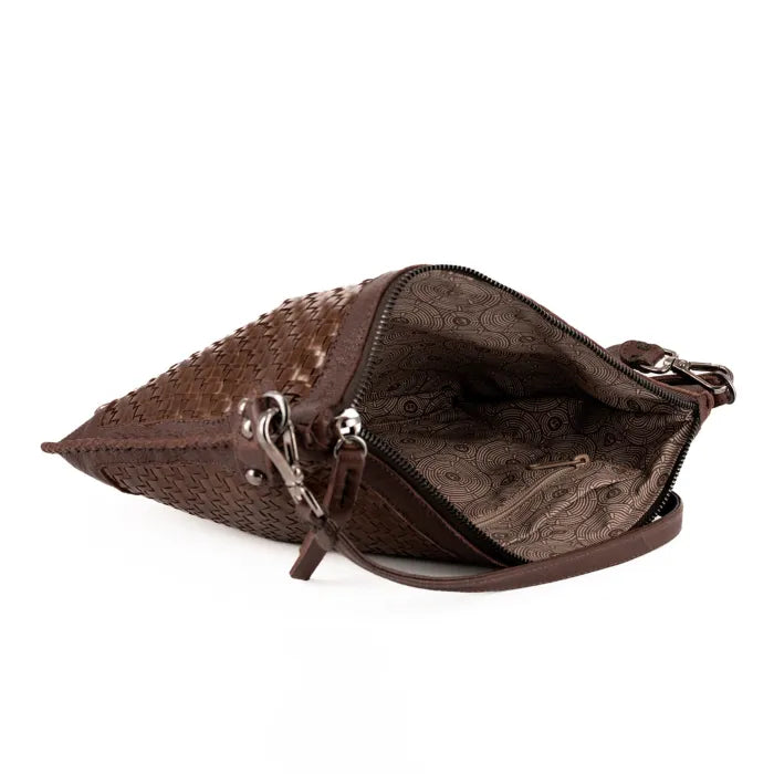 Brown leather clutch bag with intricate patterns on a white background