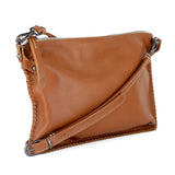 Tan leather crossbody bag on a white background