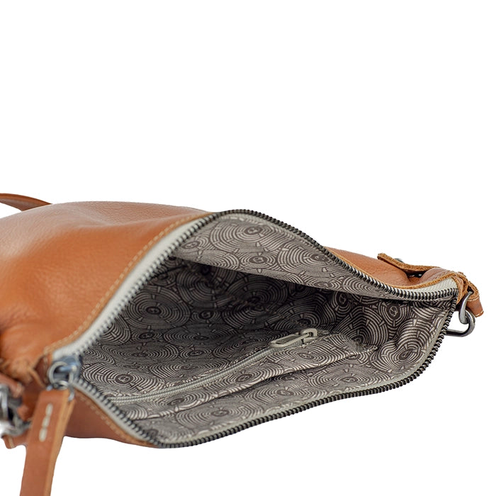 Tan leather bag with open zipper showing interior pattern on a white background