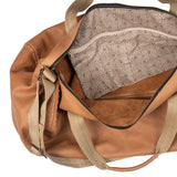 Tan leather bag with a patterned pouch inside on a white background