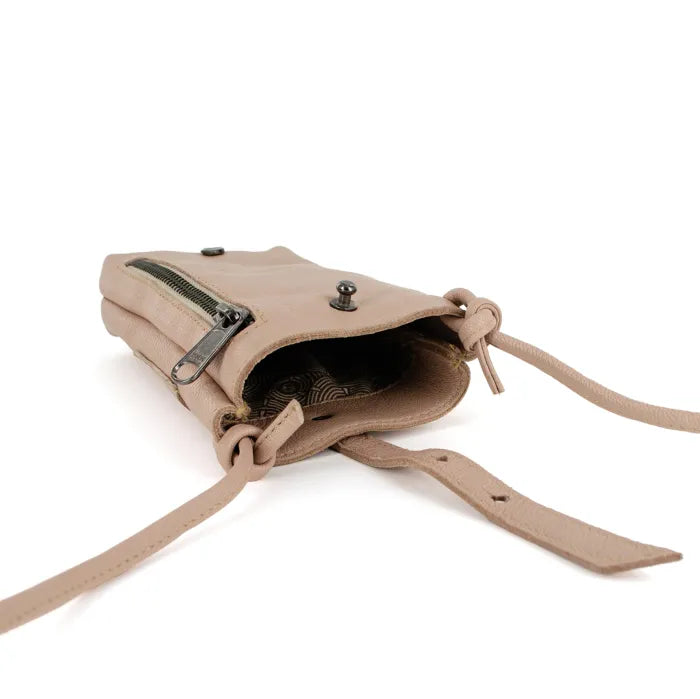 Light pink leather crossbody bag with a strap on a white background